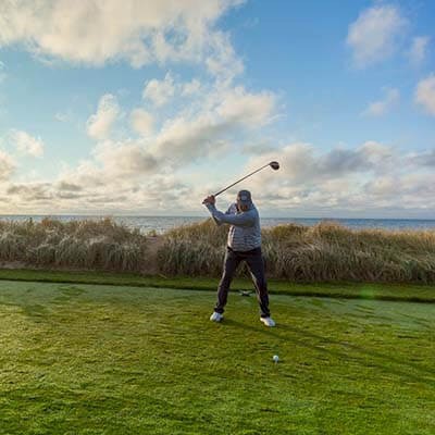 man playing golf at New Seabury golf course